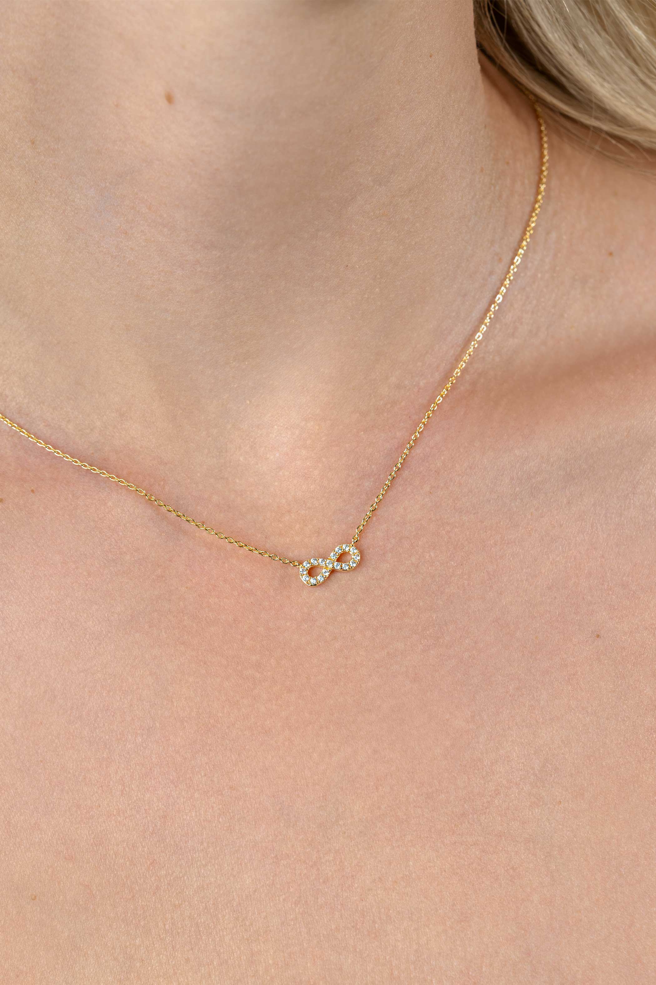 ZINZI gold plated silver necklace with Infinity sign fully set with white zirconia 42-45cm ZIC2597Y